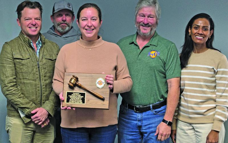 Sentinel Photo/Jessica Shepard Bay City Community Development Corporation presented a service award plaque to past BCCDC Executive Director Jessica Russell, center, on Friday, Jan. 16. Russell is joined by board members Bradley Westmoreland, Clint Hewitt, BCCDC Board President Jim Folse, BCCDC Board Vice President Erandi Allison.