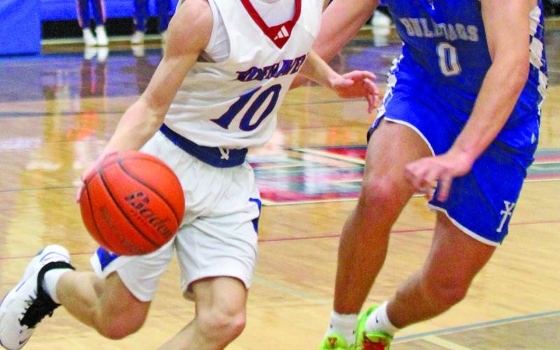 Tidehaven’s Ivan Espinosa (10) drives against a Yoakum defender in a recent game. The Tigers are 6-5 overall, and 2-5 in district and were to play Columbus at home Tuesday, Jan. 27, and at Hallettsville Friday, Jan. 30. Photo by Anna Hernandez