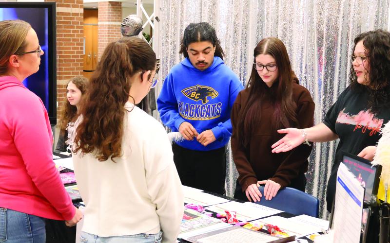 BCHS Yearbook Staff photo by Cameron Sosa Bay City High School Dungeoneers share their theater experiences with future freshmen during the Bay City High School's "Annual Academic &amp; CTE Showcase" on Friday, Feb. 13. The event partnered campus academic and extracurricular offerings with local businesses and career fields.