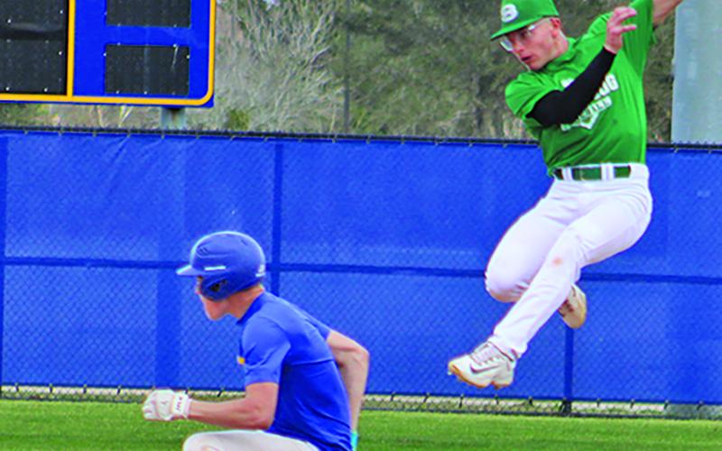 Sentinel Photo/Mike Reddell Blackcat Wade Frasier ducks under a Boling throw to arrive safely at second.