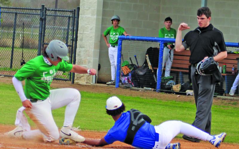 Sentinel Photo/Mike Reddell Blackcat pitcher Davieon Agu puts out Boling runner while covering home.
