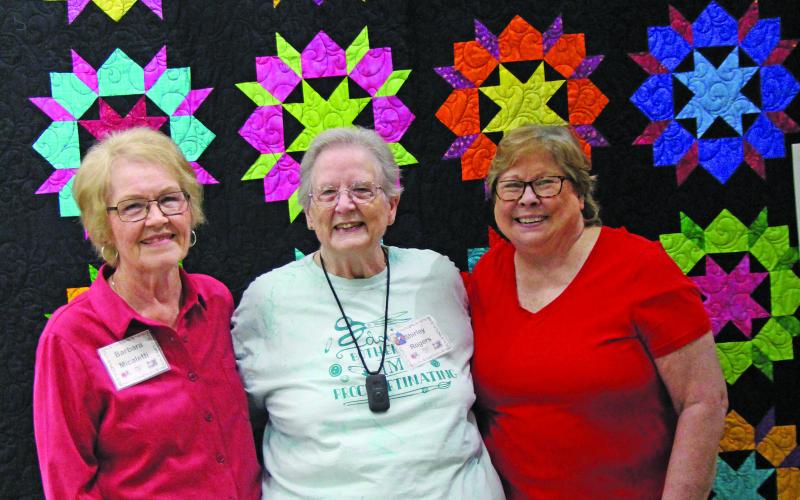 Sentinel Photo/Mike Reddell Memory Makers Quilt Guild Show winners were recognized at the annual show exhibition on Jan. 28. Winners posed with this year’s raffle quilt, from left are Barbara Micaletti, second place; Shirley Rogers, first place; and Sue Felix, third place.