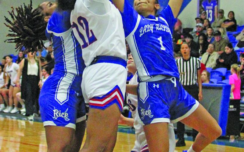 Photo by Anna Hernandez Tidehaven sophomore Nevaeh Dove goes up to reach the ball during a Feb. 10 game against Rice that Tidehaven won 45-20. The Tigerettes stand 28-6 on the season and 12-2 in district (second). Tidehaven started UIL championship playoff action Monday, Feb. 16, in first-round action against Stockdale.