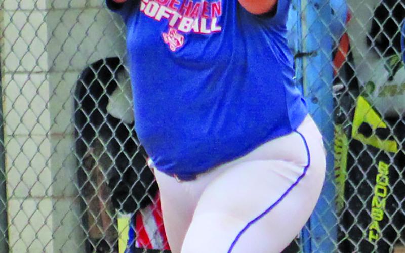Tidehaven first baseman catches a throw for a Bay City out.