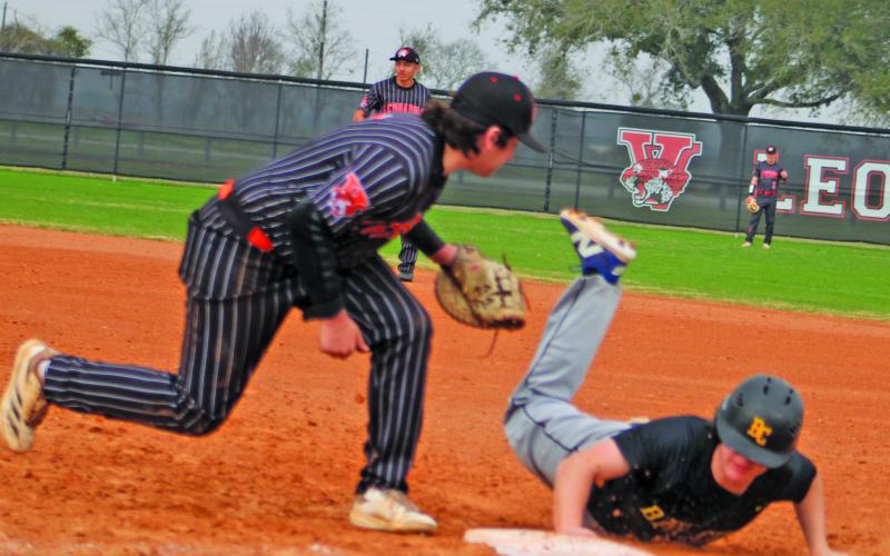 Sentinel Photo/Mike Reddell A Blackcat narrowly avoids a put out at first against Van Vleck