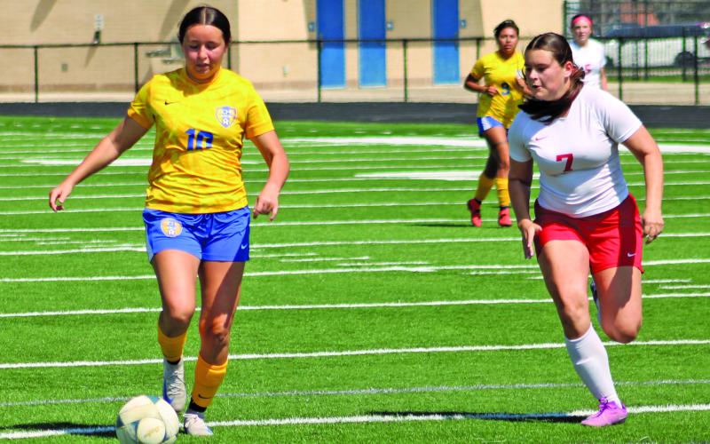 Sentinel photo/Mike Reddell Bay City sophomore Lexi Castro (10) dribbles downfield.