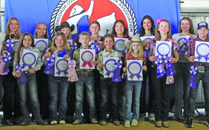 Sentinel photo/Jessica Shepard  Matagorda County Fair and Livestock Association's Home Economics food entry winners received purple rosettes for their win as Grand Champions of their chosen divisions Saturday, Feb. 28. Winners include Raelyn Owen, Ellie Hutto, Abagail Straub, Meredith Jones, Aubree Savage, Olivia Mitchell, Ashley Alford, Drake O’Connell, Abigail Jurek, Ellie Curtner, Jase Alford, Aribella Carson, Jayci Downs, Keagan Gerberman, Taylor Martinez, Savannah Remmy, and Jace Reynolds.
