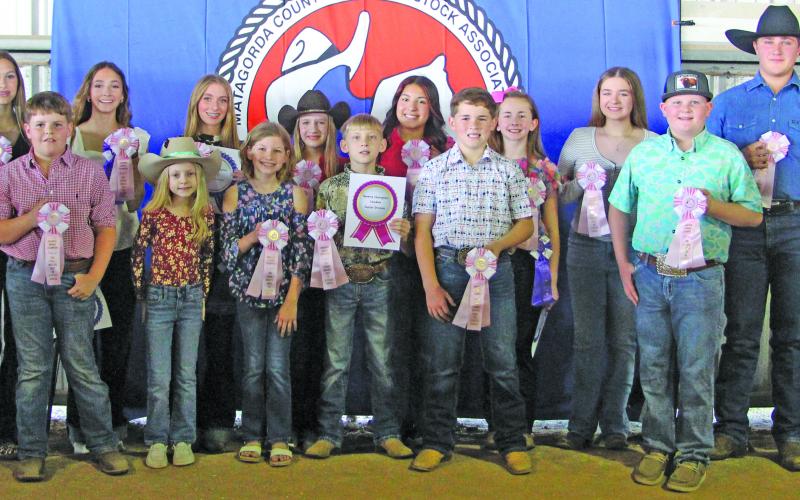 Sentinel photo/Jessica Shepard Matagorda County Fair and Livestock Association's home economics food division reserve grand champions earned pink rosettes for winning their chosen divisions Saturday, Feb. 28. Winners include Meredith Jones, Emma Fuentes, Brooks O’Connell, Tennyson Massey, Coleman Dodd, Aubree Savage, Maddox Wendel, Kynlee Tucker, Stephen Carson, Ashley Alford, Ellie Curtner, Madelyn Botbyl, Hank Chandler, Taylor Martinez, Aribella Carson, Jace Reynolds, and Jayci Downs.