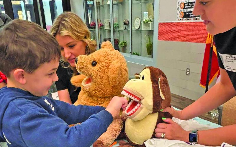 VVISD Photo Van Vleck High School Health Science Teacher, Kim Wied, along with her Health Practicum and Theory classes, held the annual Teddy Bear Animal Clinic at Van Vleck Elementary recently. Also assisting were Mrs. Erron Steinmann, Mrs. Missy Jurek, and Mrs. Lyndee Owen. Kindergarten students participated in activities with their own stuffed animals including learning about dental hygiene, xrays, and wellness checks to help them understand how healthcare professionals help us.