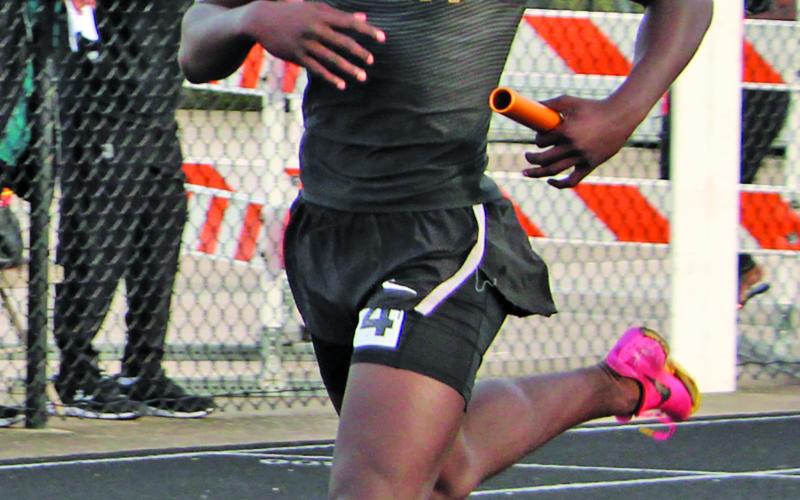 Sentinel Photo/Mike Reddell Blackcat relay runner Aiden Williams part of winning track team.