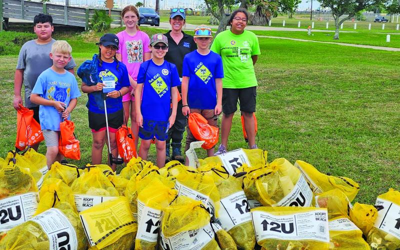 Contributed photo Cub Scout Park 4545 were among the 50 volunteers who gathered along the shoreline of Palacios Bay Beach, working together to remove nearly 200 pounds of trash and filling 43 bags in the process on April 18.