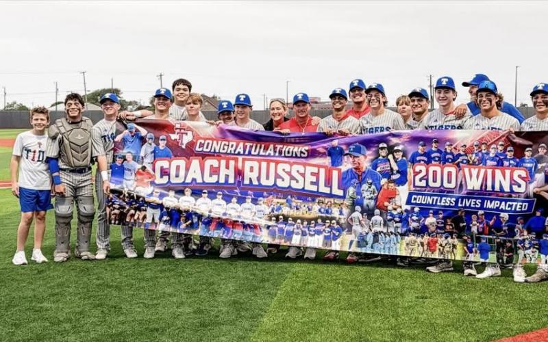 Contributed photo Tidehaven baseball players and staff congratulate Coach Eddie Russell on 200 wins and the many lives he has shaped along the journey.
