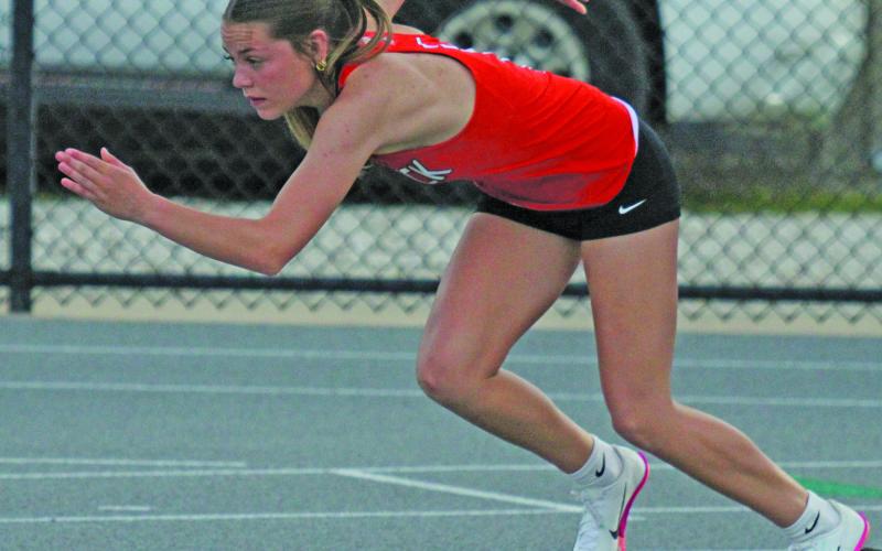 Photo by Anna Hernandez Van Vleck’s Peyton Van Dyke launches from the blocks for the 400 meter dash.