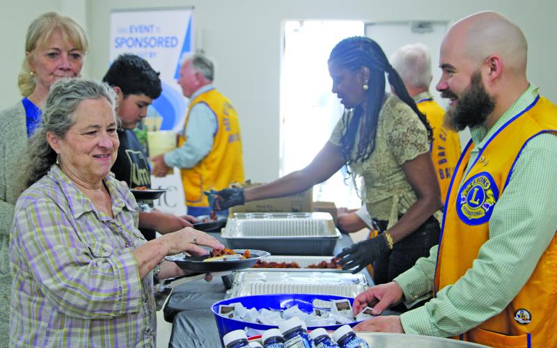 Sentinel Photo/Mike Reddell Bay City Lions Club members did their part to make sure people who attended the club’s pancake supper March 26 at the KC Hall had a plate full of pancakes, sausage, and bacon.
