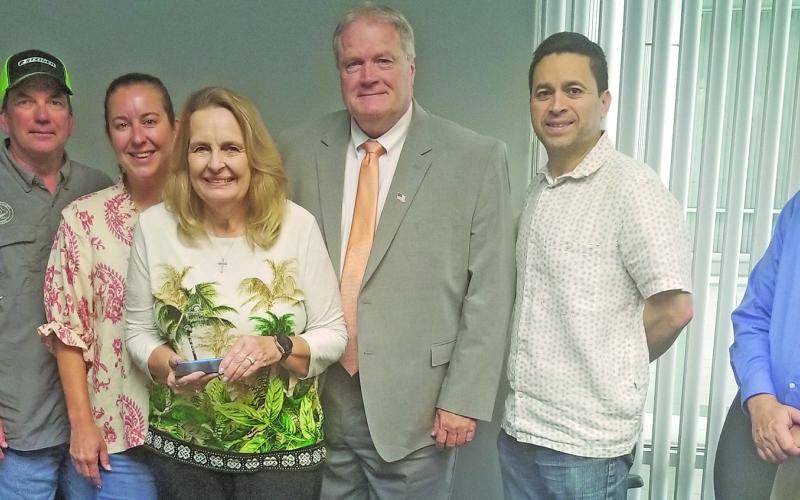 Sentinel Photo/Mike Reddell The Matagorda County Economic Development Corporation board recently recognized outgoing board member Pam Oliver of Palacios, center, for her years of service on the board.