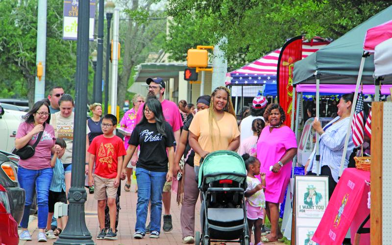 Sentinel Photo/Jessica Shepard Customers braved ominous skies, mosquitoes, and lovebugs to shop at Downtown Bay City Market Day on Saturday, April 25. Vendors showed off a variety of wares from homemade jams and jellies to indoor and outdoor decorations, along with several informational booths and food trucks.