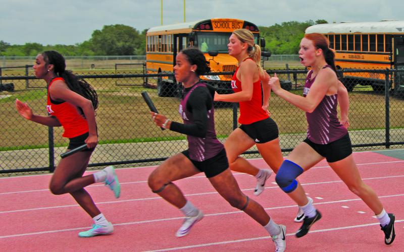 Sentinel Photo/Mike Reddell Two Van Vleck girls are in good position in their relay at Van Vleck last week.