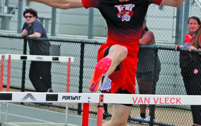 Sentinel Photo/Mike Reddell A Van Vleck hurtler clears barrier at the Van Vleck Pre-District Warm-up meet last week.