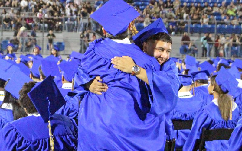 Sentinel Photo/Jessica Shepard  Two Bay City graduating seniors hug to celebrate the joy of graduation.