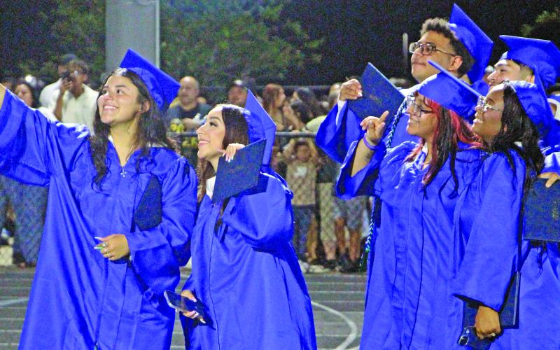 Sentinel Photo/Jessica Shepard New minted Bay City High School graduates get a group selfie at ceremonies Friday, May 22, at Memorial Stadium.