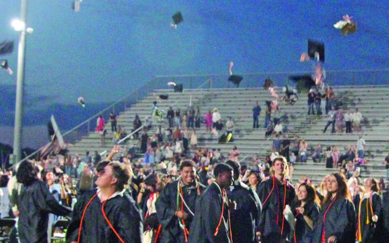 Sentinel Photo/Jessica Shepard  Van Vleck graduating seniors let their mortar boards fly at the school’s graduation ceremonies last week.