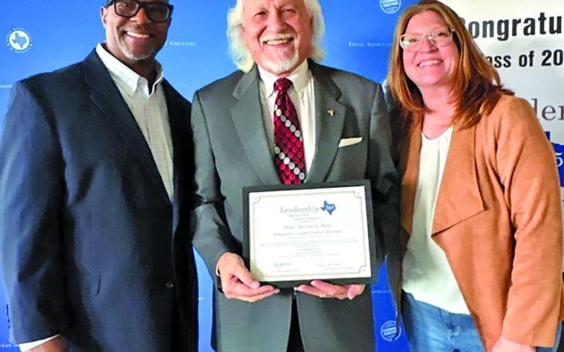 Contributed photo Attached photo includes, from left: Guest speaker Dallas County Clerk John Warren, Matagorda County District Attorney Steven Reis, and Director of Education &amp; Member Services Haley Click.