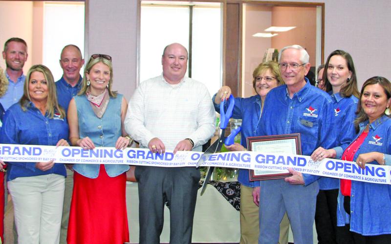 Sentinel photo/Mike Reddell A Ribbon Cutting Re-Branding Celebration for Texan Title Holding was held Thursday, May 14, at 2021 Ave. G. Formerly known as Bay City Abstract &amp; Title Company - with the same faces in the same roles as before. Bay City Chamber of Commerce &amp; Agriculture hosted the open house.