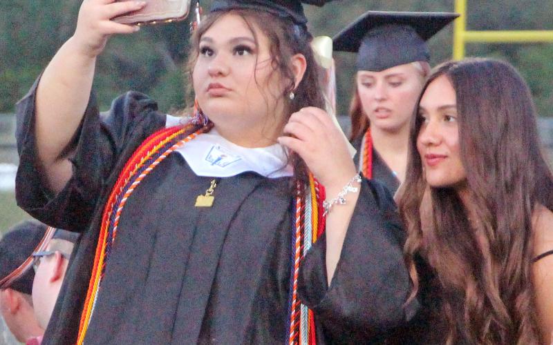 Sentinel Photo/Jessica Shepard Several senior students created lasting memories during their respective graduation ceremonies last week. Van Vleck seniors paused to take a selfie while their class song "Landslide" by Fleetwood Mac played through the stadium on May 21.
