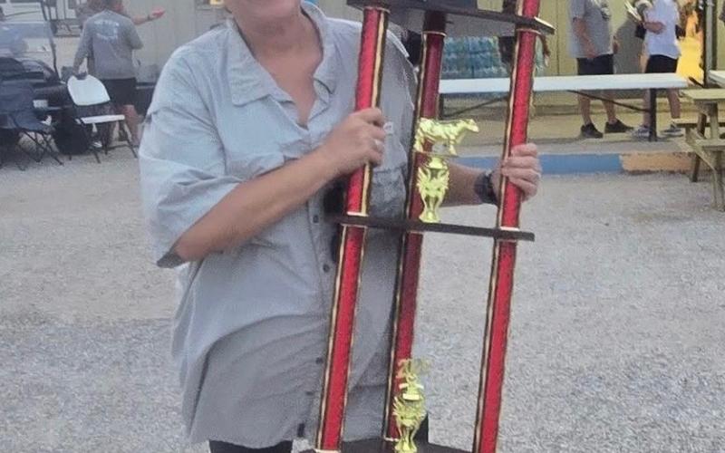 Go Texan photo 1st place brisket ($4,000) went to a Brazoria County individual but she is born and raised in Bay City. Nancy Ainsworth. She competes against her husband and hear him. Nancy Ainsworth showing off trophy for $4,000 prize.