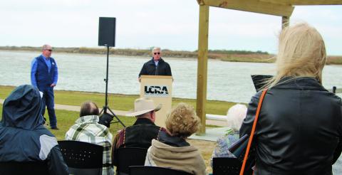 Sentinel photo/Mike Reddel Loy Sneary explains how the memorial was organized at the dedication Jan. 25.