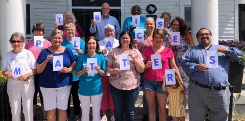Contributed photo Matagorda County Historical Commission members pictured on the front steps of Palacios’ Luther Hotel show that they believe “This Place Matters.”