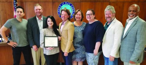 Sentinel Photo/Mike Reddell Main Street Manager Tina Israel presented the 2023 Main Street America Accreditation award at City Council’s June 13 meeting. Shown are, from left, City Councilmen Ben Flores and Blayne Finlay, Israel, Council Members Bradley Westmoreland and Becca Sitz, City Manager Shawna Burkhart, Mayor Pro Tem Jim Folse,and Mayor Robert Nelson.