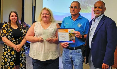 Contributed photo City staff show off H-GAC Water Wise Award for Riverside Park Community Tree Give Away.