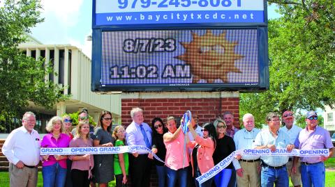 Sentinel Photo/Jessica Shepard BCCDC and Main Street Program partnered with the Bay City Chamber of Commerce & Agriculture to celebrate the rehabilitation of its digital sign with a ribbon-cutting Monday morning at the courthouse. The newly rehabilitated sign has been a BCCDC project goal since January of this year.