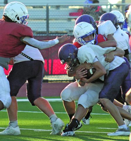 Anna Hernandez photo Tidehaven defenders make a stop on a Shiner running play at last Friday’s scrimmage.