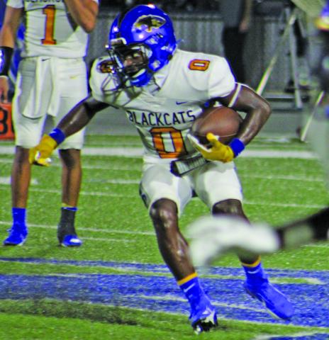 Sentinel Photo/Mike Reddell Bay City junior running back Jada Andrews (0) looks for an opening against Edna last Friday.