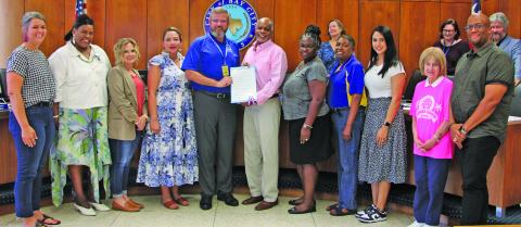Sentinel Photo/Mike Reddell City Council last week approved a proclamation recognizing October 5, 2023, as "Bay City Teachers' Day." At the center of photo, Bay City ISD Superintendent Dwight McHazlett (left) and Mayor Robert Nelson show off the proclamation.