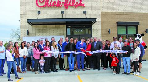 Sentinel Photo/Jessica Shepard Chick-fil-A Bay City celebrated its "Grand re-opening" with a ribbon-cutting ceremony on Wednesday, Nov. 29. The event recognized CFA Bay City Owner-Operator Nick Burnside along with his family, employees, and Matagorda Couny community leaders. 