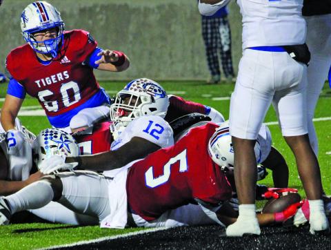 Sentinel Photo/Mike Reddell Tigers’ Joseph Dodds (5) puts the ball across goal line for the winning score.