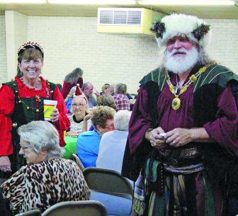 Sentinel Photo/Jessica Shepard At the Economic Action Committee of the Gulf Coast's annual "Christmas Luncheon" seniors and event volunteers got to meet a Hungarian Santa and Mrs. Claus on Wednesday, Dec. 20. The event featured a turkey lunch, door prizes, and fellowship infused with holiday spirit. 
