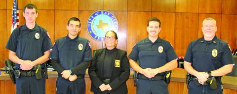 Sentinel Photo/Jessica Shepard At promotion ceremonies last week three new officers were sworn in and Sergeant Chris Hadash was pomoted to lieutenant. From left: Cody Janssen, Ryan Saucedo, Chief Christella Rodriguez, Braeden Fojtik and Hadash.
