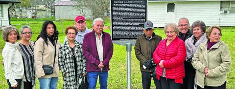 Top: The group picture with marker includes former students and children of students. 