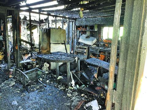 Photo by Dan Shook Interior of destroyed Wadsworth residence utility room.