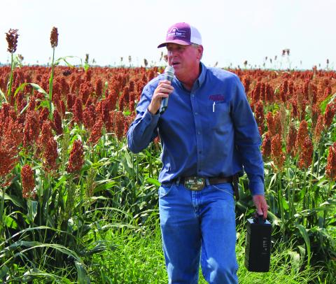 Sentinel Photo/Jessica Shepard Matagorda County Agriculture and Natural Resources Extension Agent Greg Baker identified several crop rows as sorghum grain trial crops near FM 521 to “Matagorda County Row Crop Tour” attendees last Thursday. Baker also took the group to corn and cotton crops in the El Maton area.