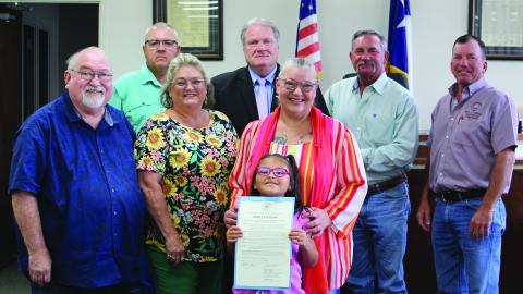 Matagorda County Commissioners Court unanimously approved a proclamation designating June as "Myasthenia Gravis Awareness Month" Monday morning, June 3. Joining the commissioners were, from left: Simon DeSoto, Laurie Weathers, Andrea Savage, and Rylee Savage. Sentinel Photo/ Jessica Shepard