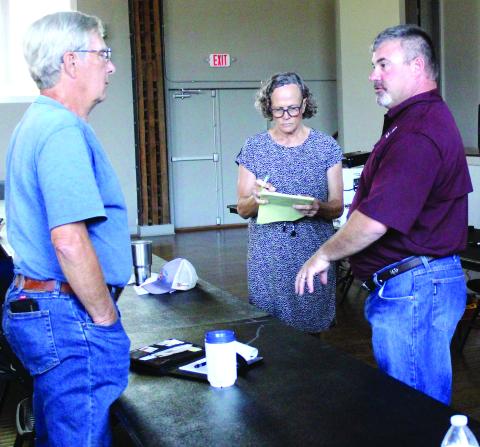 Sentinel Photo/Jessica Shepard Corpus Christi Texas A&M AgriLife Extension Livestock Specialist Dr. Karl Harborth, left, addresses concerned ranchers at the Matagorda County Soil & Water Conservation District’s (SWCD) workshop on June 7.