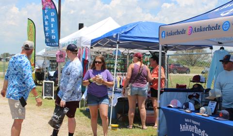 Sentinel Photo/Jessica Shepard The 5th Annual Matagorda Surf & Turf Festival featured vendors peddling everything from food and custom tumblers to T-shirts and resin decor last Saturday. Proceeds from the event are earmarked for Matagorda beach and bay beautification and conservation projects. 