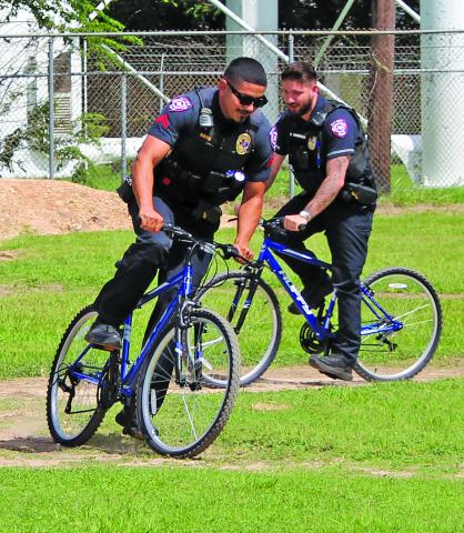Sentinel Photo/Jessica Shepard Two Bay City Police officers were among several bicycle riders at the grand opening of Bay City's new "BMX Bike Park" Saturday, June 29. The BMX Bike Park is at 3212 Ave. E by the water tower