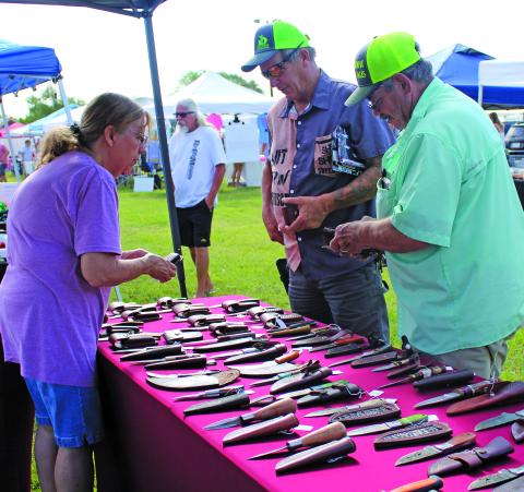 Sentinel Photo/MaLinda Reddell Matagorda Historical Society hosted Christmas In July in Heritage Park last Saturday. The society raises funds to keep history alive in Matagorda. Society members will work on fixing a local structure for a new home for the Texas Navy. 