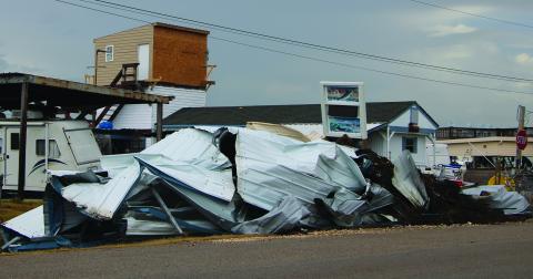 Sentinel Photo/Mike Reddell Hurricane Beryl left a trail of twisted metal in its wake. 